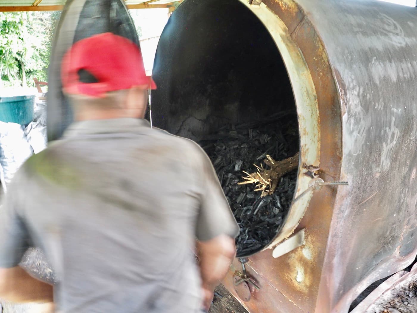 A batch pyrolysis reactor being loaded with feedstock at origin